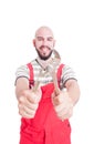 Smiling mechanic holding an adjustable wrench Royalty Free Stock Photo