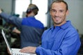 smiling mechanic in service Royalty Free Stock Photo