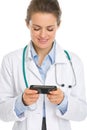 Smiling medical doctor woman reading sms Royalty Free Stock Photo