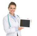 Smiling medical doctor woman showing tablet PC Royalty Free Stock Photo