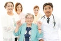 Smiling medical staff with old women Royalty Free Stock Photo