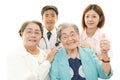 Smiling medical staff with old women Royalty Free Stock Photo