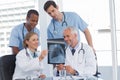 Smiling medical team examining radiography Royalty Free Stock Photo