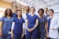 Smiling medical team standing together outside a hospital Royalty Free Stock Photo