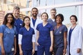 Smiling medical team standing together outside a hospital Royalty Free Stock Photo