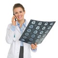 Smiling medical woman speaking mobile phone Royalty Free Stock Photo