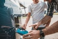 Happy male and child taking vehicle beverage Royalty Free Stock Photo