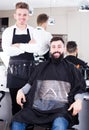 Hairdresser demonstrating his workplace