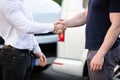 Smiling Men Shaking Hands In Front Cars Damaged After Accident