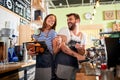 Man and woman barista owner working at coffee shop Royalty Free Stock Photo