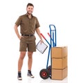 Smiling Messenger Is Standing Close To A Push Cart Royalty Free Stock Photo