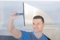 Worker Cleaning Glass Window With Squeegee Royalty Free Stock Photo