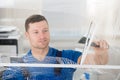 Worker Cleaning Soap Sud On Window With Squeegee Royalty Free Stock Photo