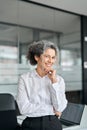 Smiling middle aged business woman leader standing in office, vertical portrait. Royalty Free Stock Photo