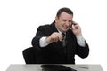 Smiling middle-aged businessman holds on the cellphone