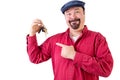 Smiling middle aged man pointing at car keys Royalty Free Stock Photo