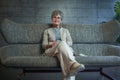 Smiling middle aged mature grey haired woman looking at camera, happy old lady in glasses posing at home indoor Royalty Free Stock Photo