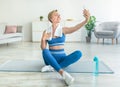 Smiling Middle-Aged Woman Exercising And Taking Selfie Royalty Free Stock Photo