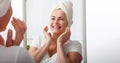 Smiling middle aged woman satisfied with her nature beauty. Cosmetic facial care concept Royalty Free Stock Photo