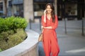 Attractive woman using smartphone at sidewalking in the city Royalty Free Stock Photo