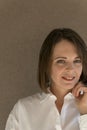 Smiling middle aged woman in white shirt. Close up portrait. Business woman in formal clothes Royalty Free Stock Photo