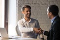 Excited businessman handshake male applicant at job interview Royalty Free Stock Photo