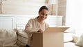 Happy young woman satisfied with internet shopping order Royalty Free Stock Photo