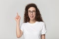 Happy millennial girl raise finger catching interesting idea