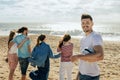 Smiling millennial diverse friends and european man in casual with ball have fun, enjoy freedom, spare time Royalty Free Stock Photo