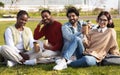 Smiling millennial diverse modern students with cup of coffee or tea takeaway study together, rest from lesson