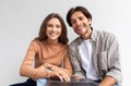 Smiling millennial european male and female look at laptop and planning to renovate or relocate Royalty Free Stock Photo