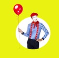 Smiling mime with balloon.Funny actor in red beret