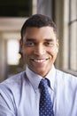 Smiling mixed race businessman, vertical portrait Royalty Free Stock Photo
