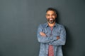 Smiling mixed race mature man on grey background Royalty Free Stock Photo