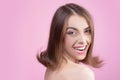 Smiling model with perfect make-up. Amazing smile. woman. White teeth. Healthy teeth. Young girl in studio on pink Royalty Free Stock Photo