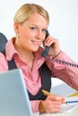 Smiling modern business woman talking on phone