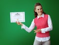 Smiling modern learner woman showing Certificate of Graduation