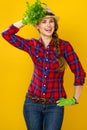 Smiling modern woman grower using fresh parsley as an accessory