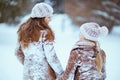 Smiling mom and child in coat, hat, scarf and mittens walking Royalty Free Stock Photo