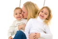 Smiling Mom Hugging and Kissing Her Little Son and Daughter Royalty Free Stock Photo