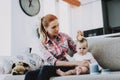 Smiling Mother Combing Hair of Cute Baby Indoors Royalty Free Stock Photo