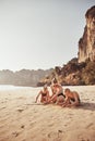 Smiling Mother and her children playing together at the beach Royalty Free Stock Photo