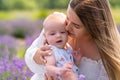 Smiling mother kissing her adorable baby boy Royalty Free Stock Photo