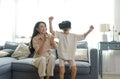 Smiling mother looking son playing games using virtual reality headsetVR at home. Technology future concept Royalty Free Stock Photo