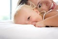 Smiling mother playing with cute baby girl Royalty Free Stock Photo