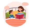 Smiling mother is reading a bedtime fairytale to her young daughter in bed Royalty Free Stock Photo