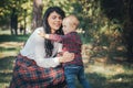 Smiling mother and son on the forest Royalty Free Stock Photo