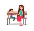 Smiling Mother and Son Sitting on Wooden Bench Royalty Free Stock Photo