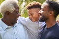 Smiling Multi-Generation Male Family At Home In Garden Together Royalty Free Stock Photo