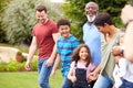 Smiling Multi-Generation Mixed Race Family In Garden At Home Together Royalty Free Stock Photo